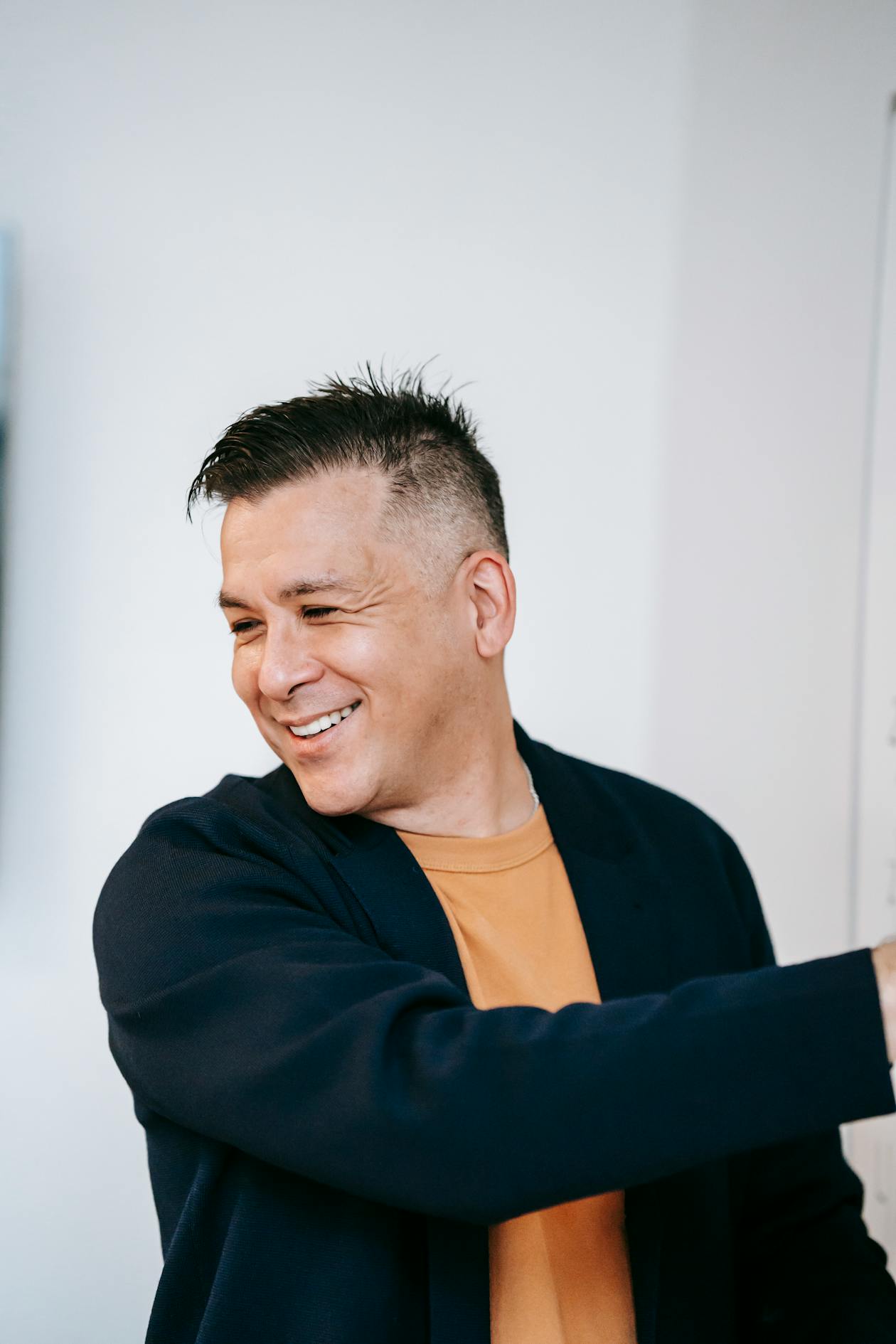 Cheerful man casual outfit smiling indoor